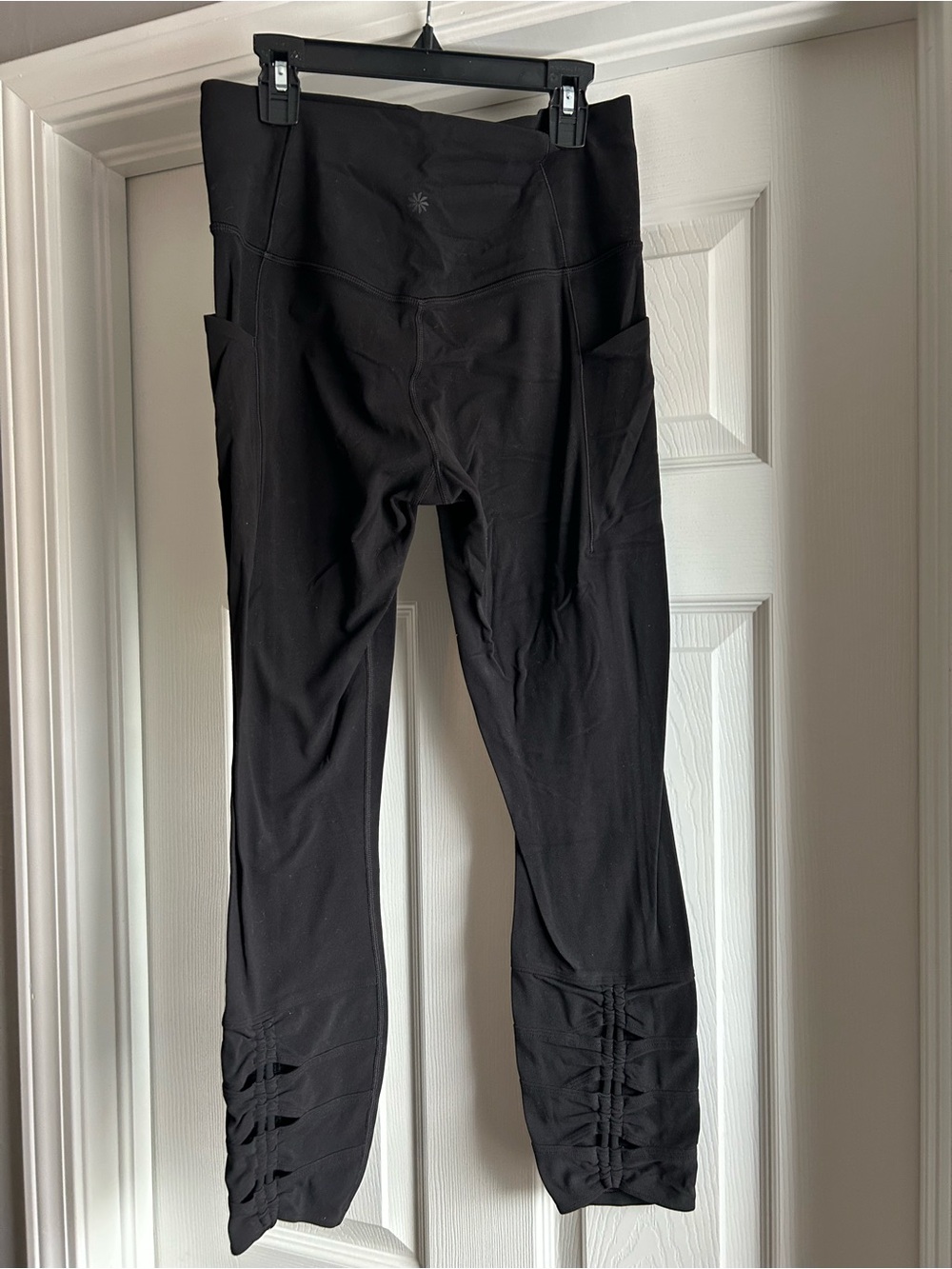 Athleta Black Salutation Stash Leggings with Side Pockets and Ruched Ankles